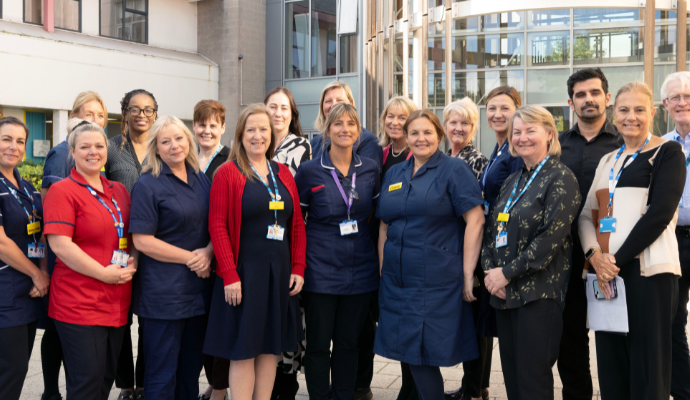 Colleagues at the Lister Diamond Jubilee Maternity Unit posing for a photograph outside the entrance at Lister Hospital in Stevenage, Hertfordshire.